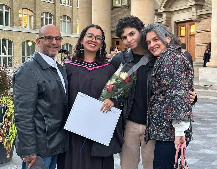 Maria Voutsinas with community members outdoors