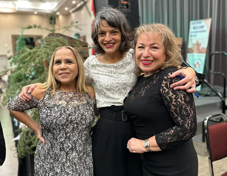 Maria Voutsinas with members of the press community